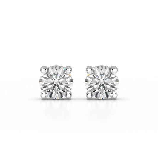 Single-stone diamond stud earrings offer timeless sophistication and versatility. - ETERNA JEWELS