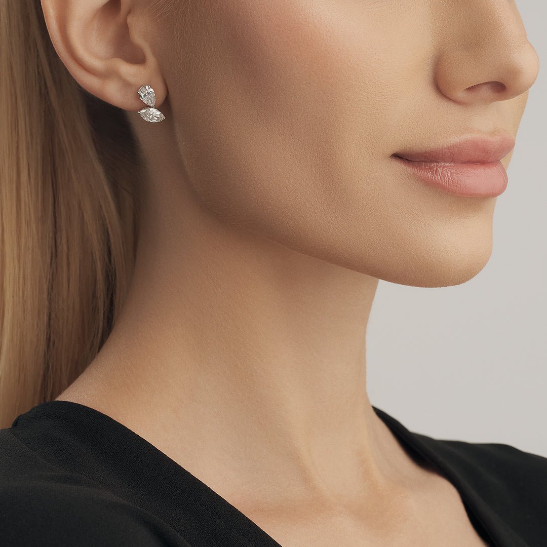 Adorn your ears with elegance in our diamond earrings, featuring captivating marquise and pear-shaped stones. - ETERNAL JEWEL