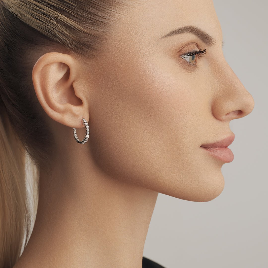 Dazzle with our diamond earrings in a stylish loop design. - ETERNAL JEWEL