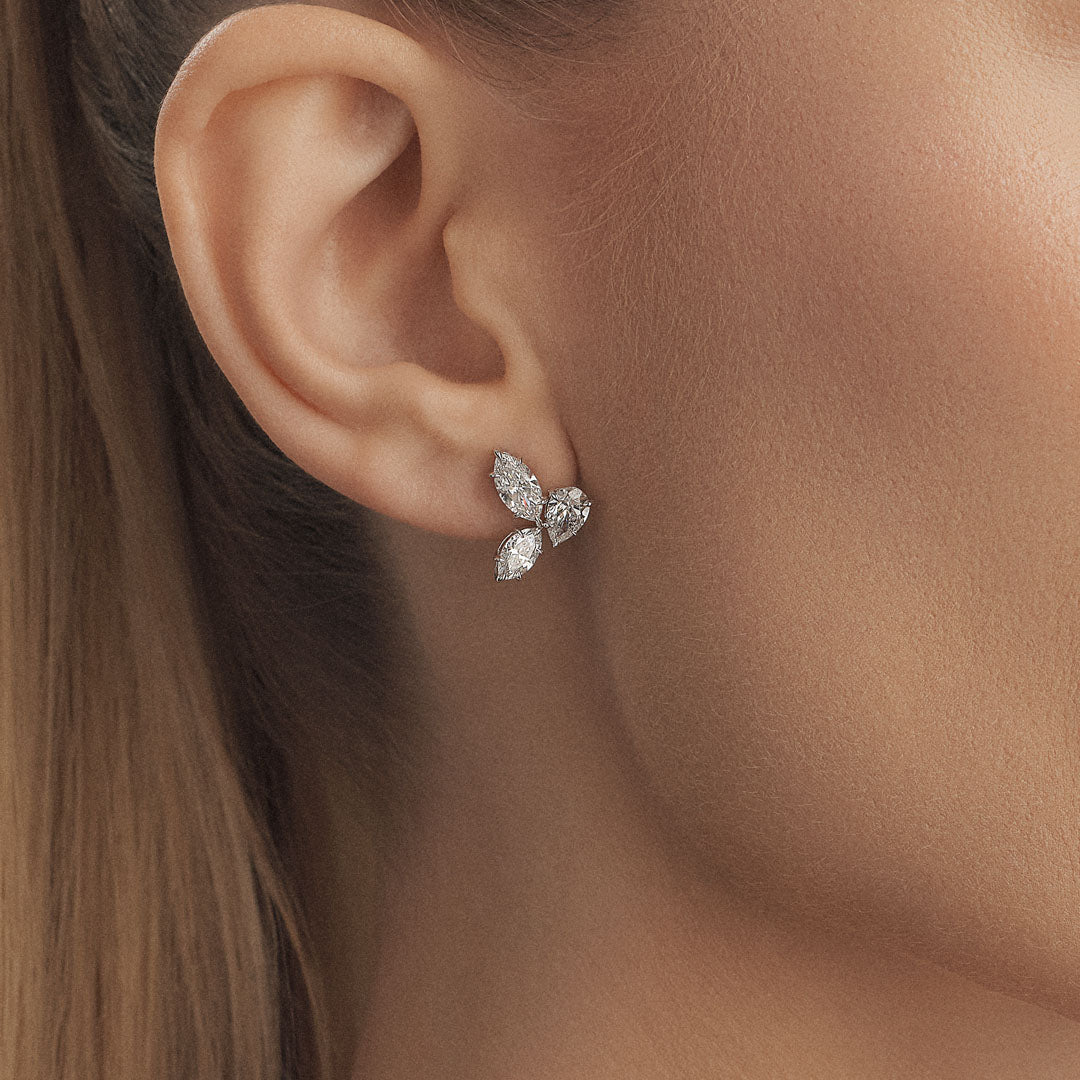 Enhance your elegance with our diamond earrings featuring two marquise diamonds and one pear-shaped diamond, a stunning combination that exudes sophistication. - ETERNAL JEWEL