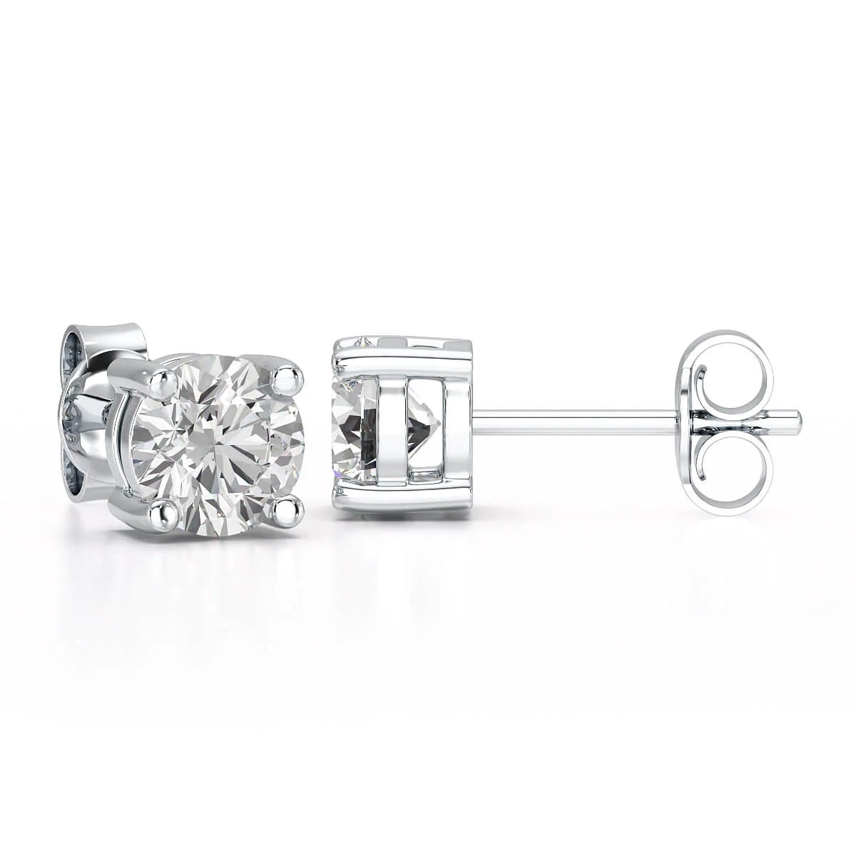 A pair of solitary diamond stud earrings. - ETERNA JEWELS