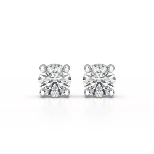 A pair of solitary diamond stud earrings. - ETERNA JEWELS