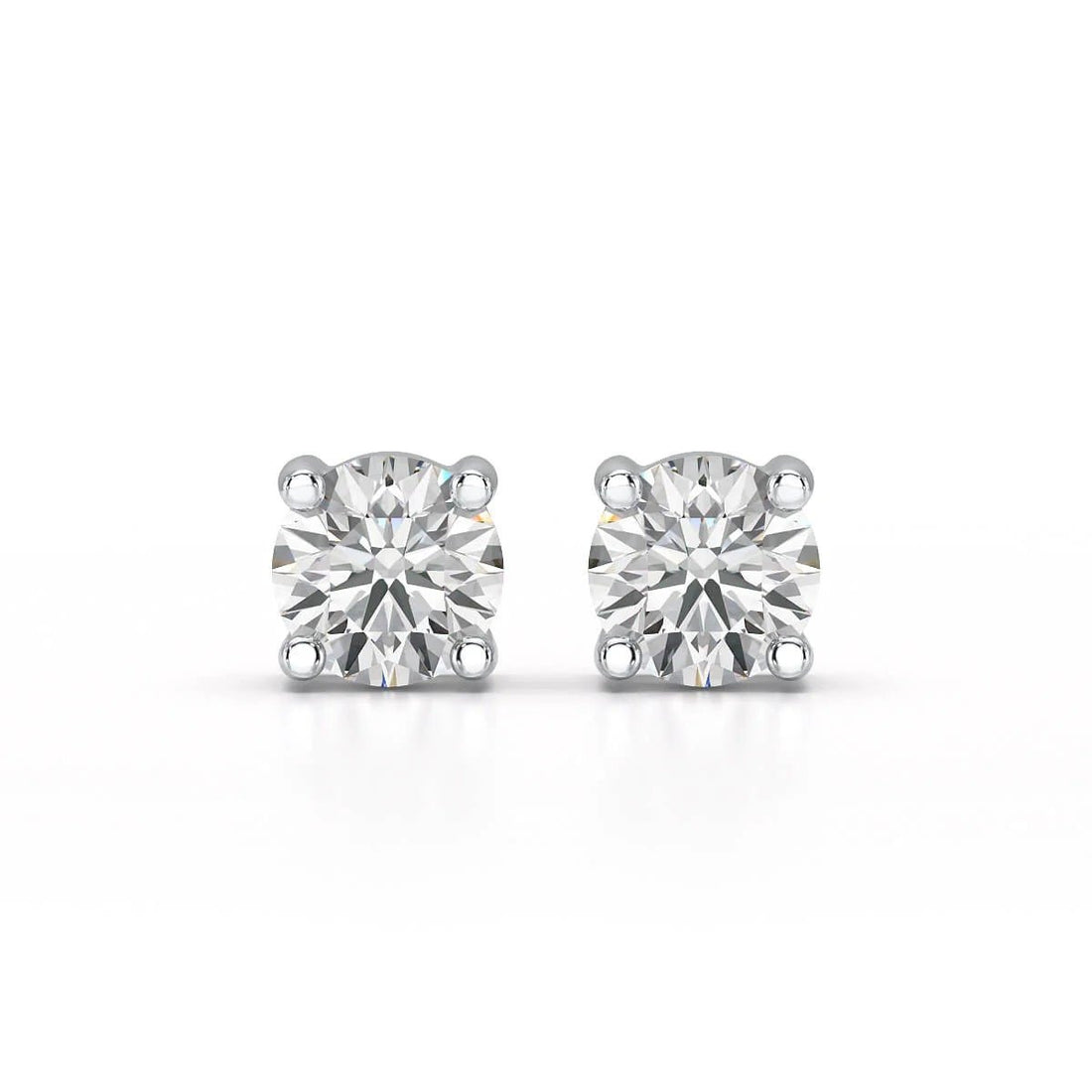 Single-stone diamond stud earrings offer timeless sophistication and versatility. - ETERNA JEWELS