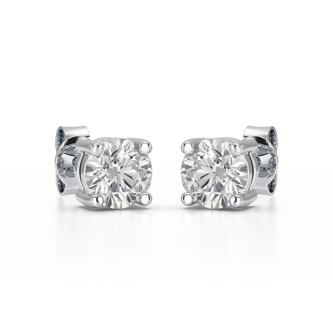 Single-stone diamond stud earrings offer timeless sophistication and versatility. - ETERNA JEWELS