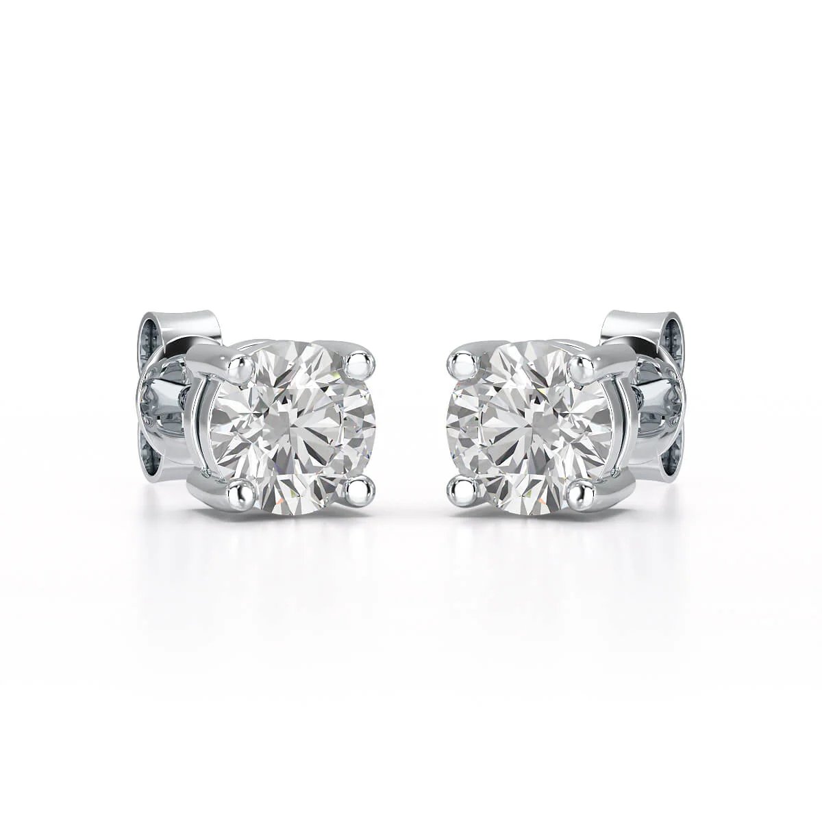 Single-stone diamond stud earrings offer timeless sophistication and versatility. - ETERNA JEWELS