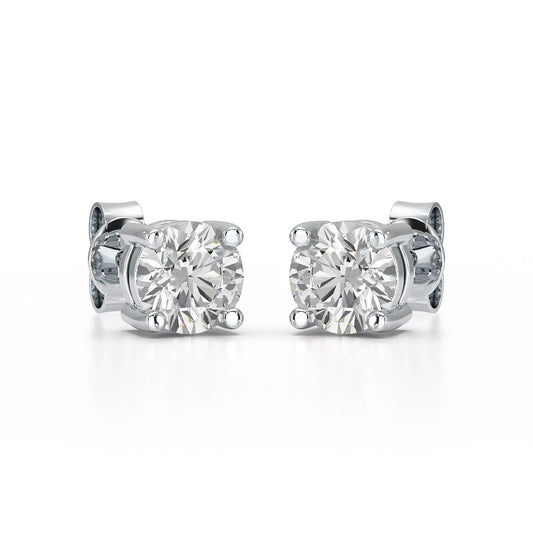 Single-stone diamond stud earrings offer timeless sophistication and versatility. - ETERNA JEWELS